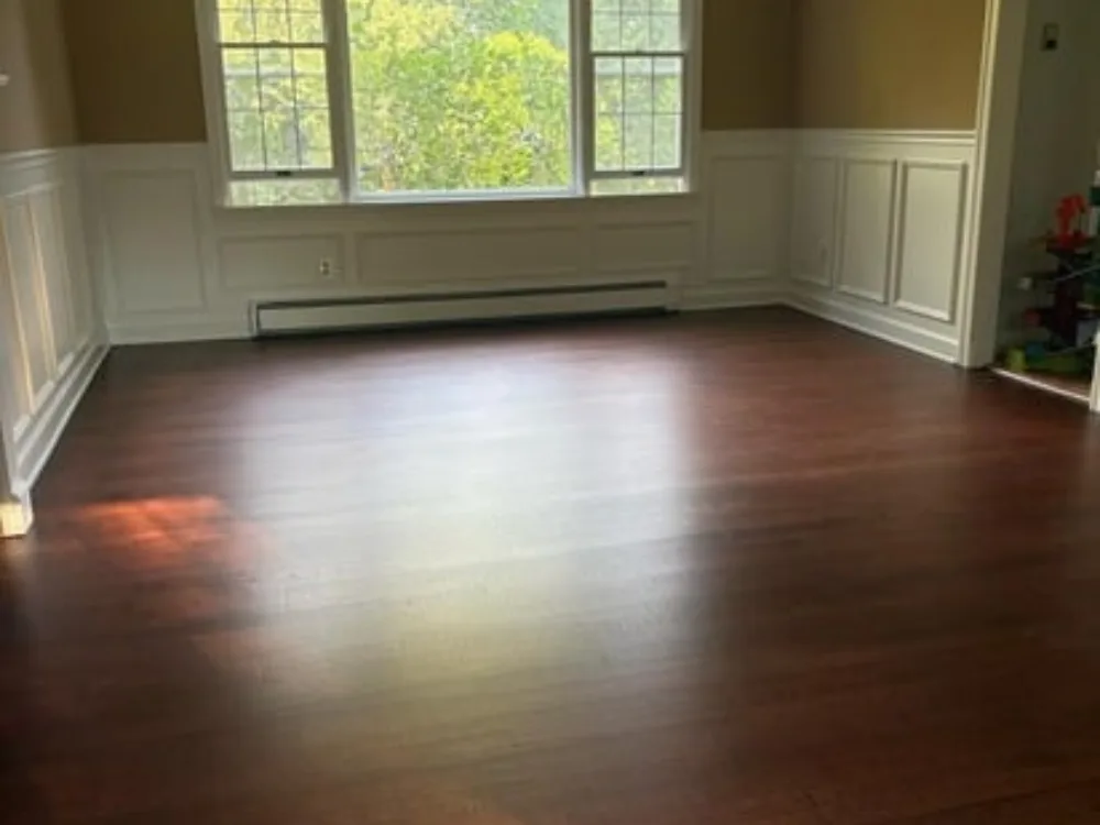 Wood floor refinishing process with fresh, polished hardwood floors.