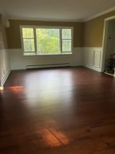 Wood floor refinishing process with fresh, polished hardwood floors.