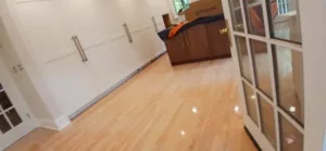 View of completed Greenwich kitchen with newly installed sheetrock, flooring, and paint.