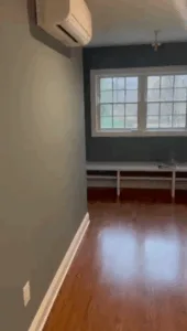 Completed hardwood floor refinishing with smooth glossy finish.