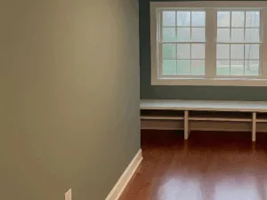 Completed hardwood floor refinishing with smooth glossy finish.