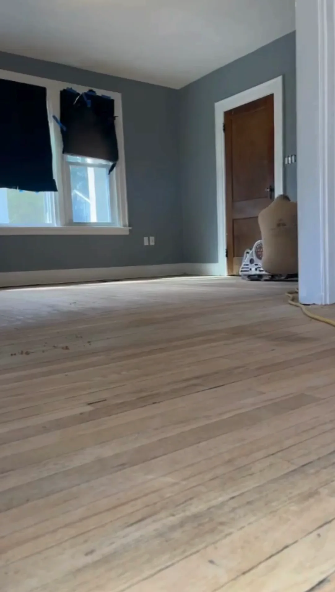 Sanded surface prepared for floor refinish old house process.
