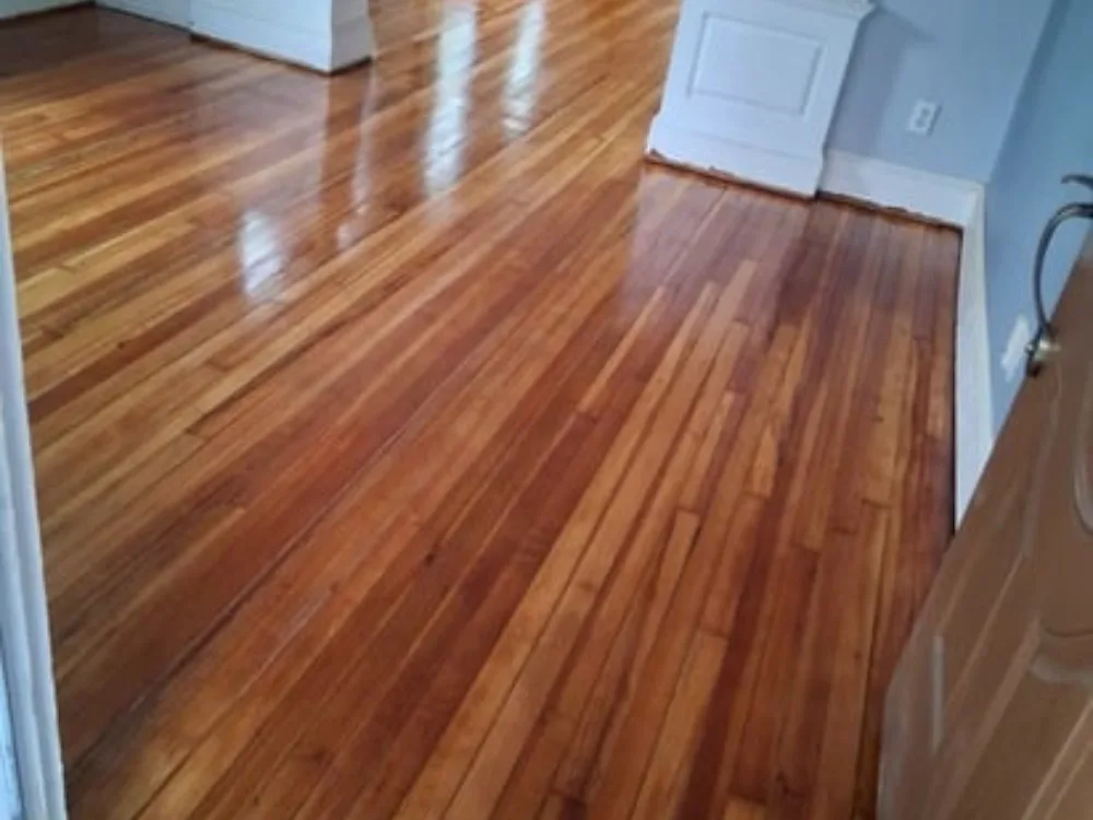 hardwood floor restoration showing newly refinished wood surface