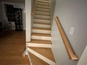 Staircase renovation with completed wood tread installation