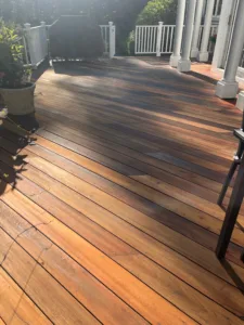 Hardwood deck restoration after cleaning and refinishing showing rich wood tones